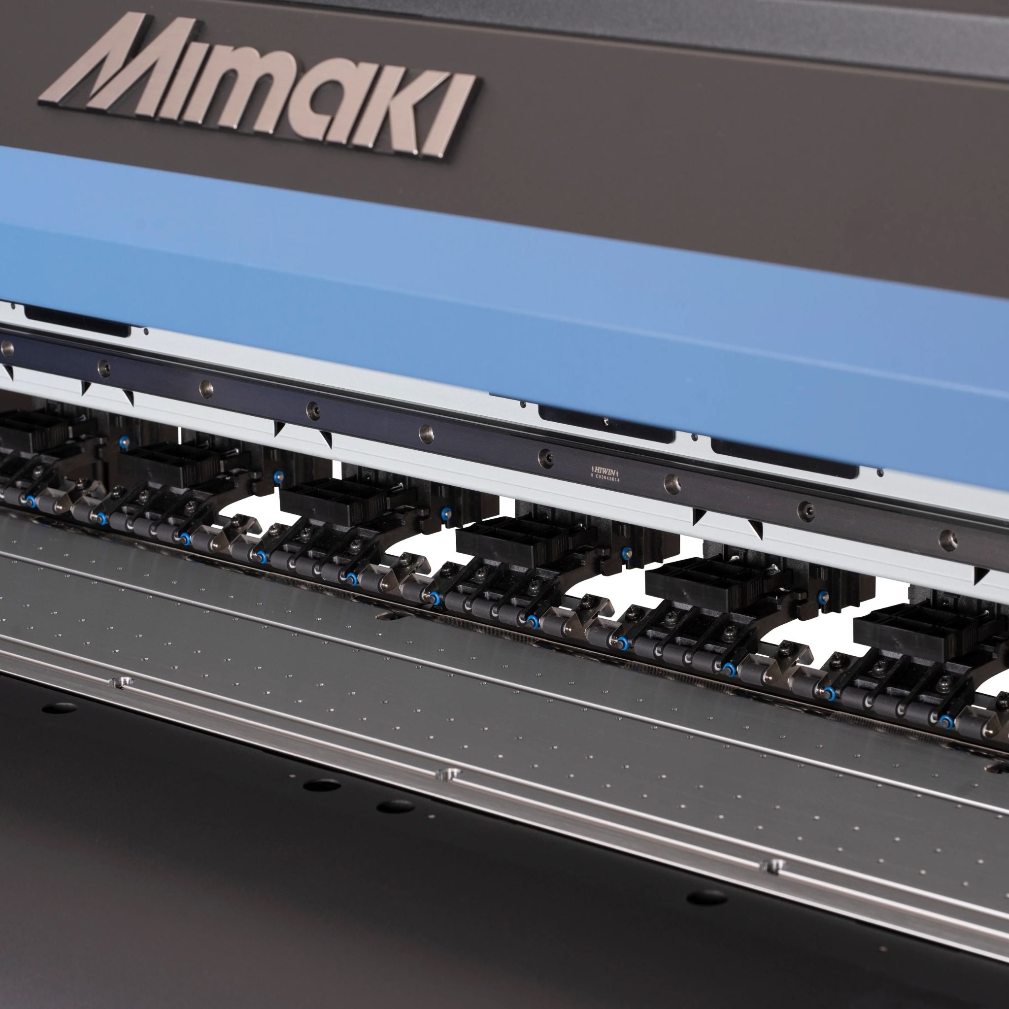 Mimaki TxF 150-75 zoomed in on printer rollers that help feed media automatically